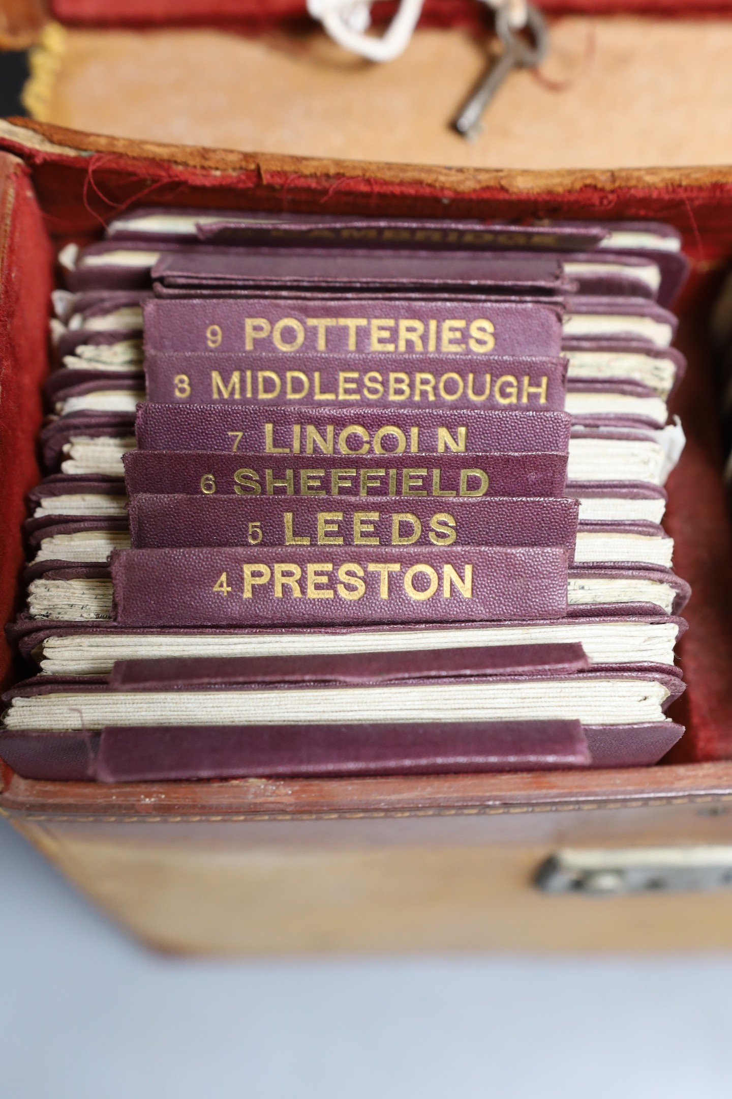 Brown leather cased set of Ordinance Survey cycling road maps of England